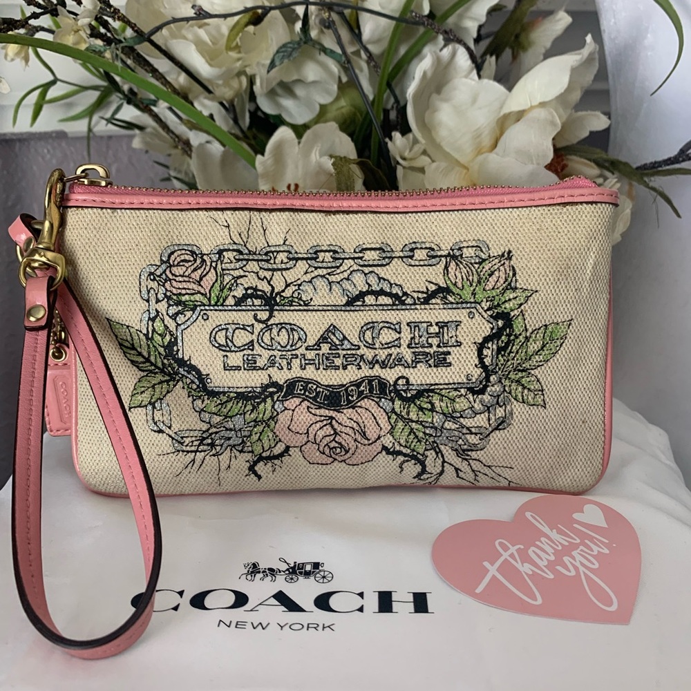 Limited Edition Coach Floral Canvas Wristlet Leather Trim and Bow
Charm